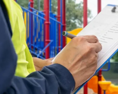 Playground maintenance and inspection records shown in context of an existing site.