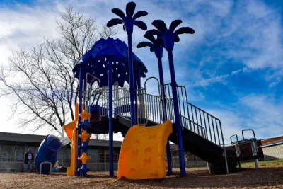 Public playground located within an active community setting.